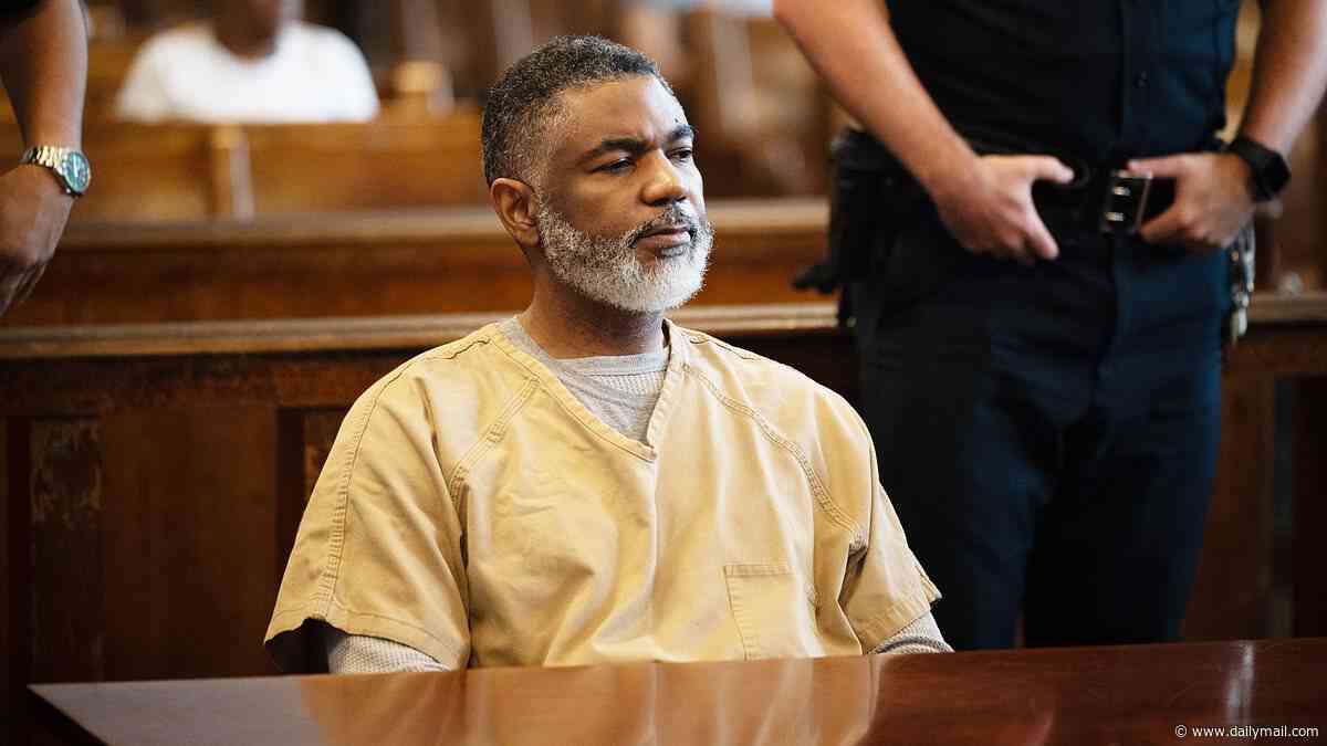 Depraved Citibank executive who drugged and raped young women in his swanky NYC apartment seen with scruffy beard and shackles as he now faces GUN charges