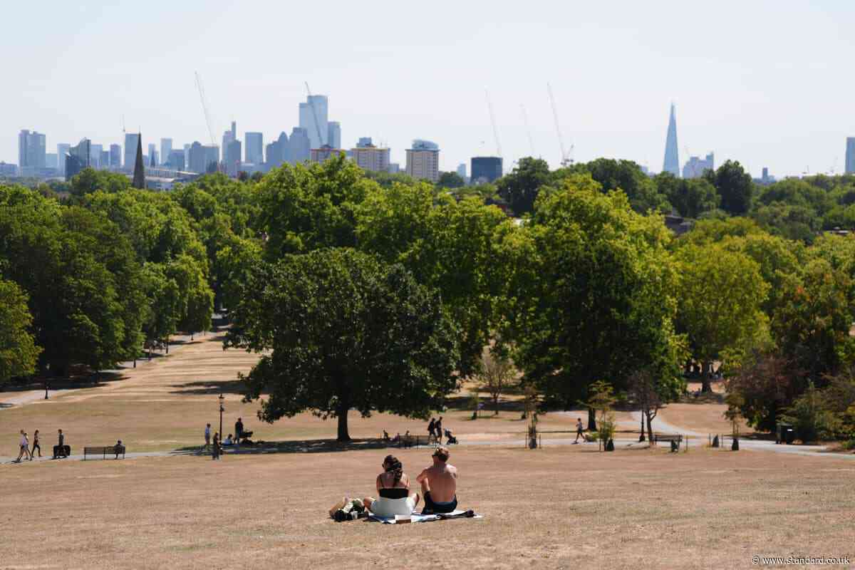 Temperatures rise above 30C while Scotland hit by half month’s rain in two days