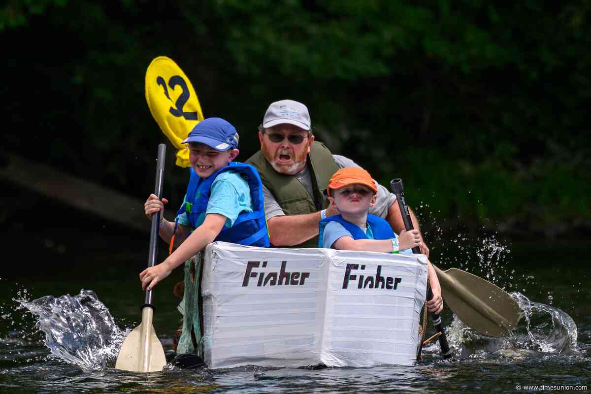 Photos: Paddlers sink, soar through cardboard boat race