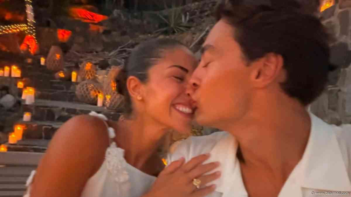 Formula One star George Russell reveals he's engaged to his long-term girlfriend Carmen Mundt as he shares snaps of stunning candlelit proposal - weeks after hinting at marriage plans