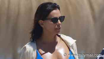 Eva Longoria, 51, makes a splash in electric blue bikini as she displays her gym-honed figure during beach day