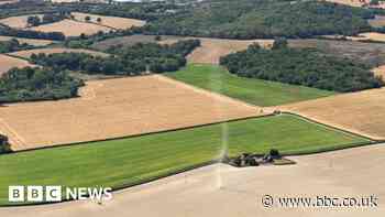 Helicopter footage shows dust devil in field