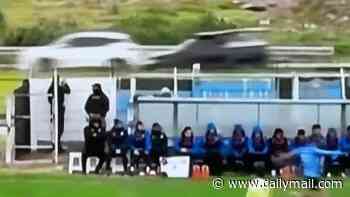 Wild moment players kick soccer ball onto busy road and cause chaotic car crash