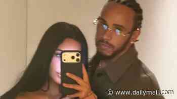 Kim Kardashian cosies up to boyfriend Lewis Hamilton before posing in a bikini in loved-up snaps after the F1 star shared how she 'makes him happier'