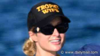 Paris Hilton, 45, flashes her 'trophy wife' credentials on yacht as husband Carter Reum snaps cheeky photos