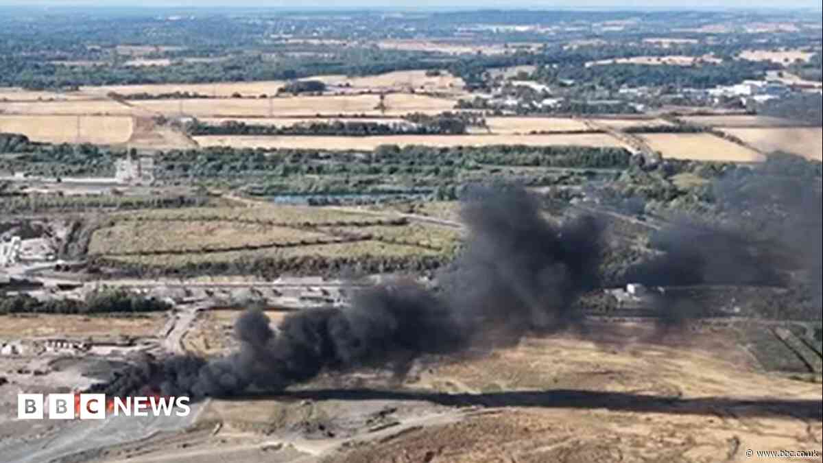 Firefighters tackle large blaze at landfill site