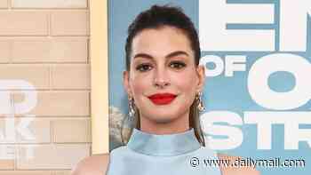 Anne Hathaway, 43, roasted over 'ridiculous' maternity outfit as she shows off baby bump at LA premiere