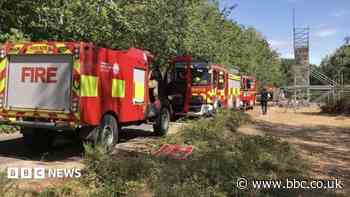 Fire crews tackle 'challenging' woodland blaze