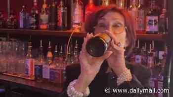 Sharon Osbourne surprises pub-goers as she pours a pint and downs beer while putting in a shift at a bar in late husband Ozzy's hometown