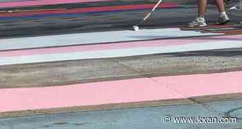 Austin High seniors give student parking lot a makeover