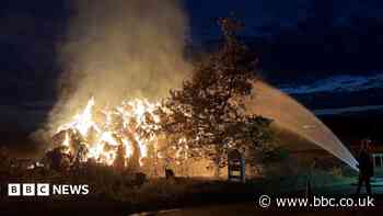Haystack 'as tall as house' catches fire