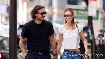 Brooklyn Beckham and wife Nicola Peltz look loved-up as they return to NYC just days after nearly running into estranged parents David and Victoria in St Tropez