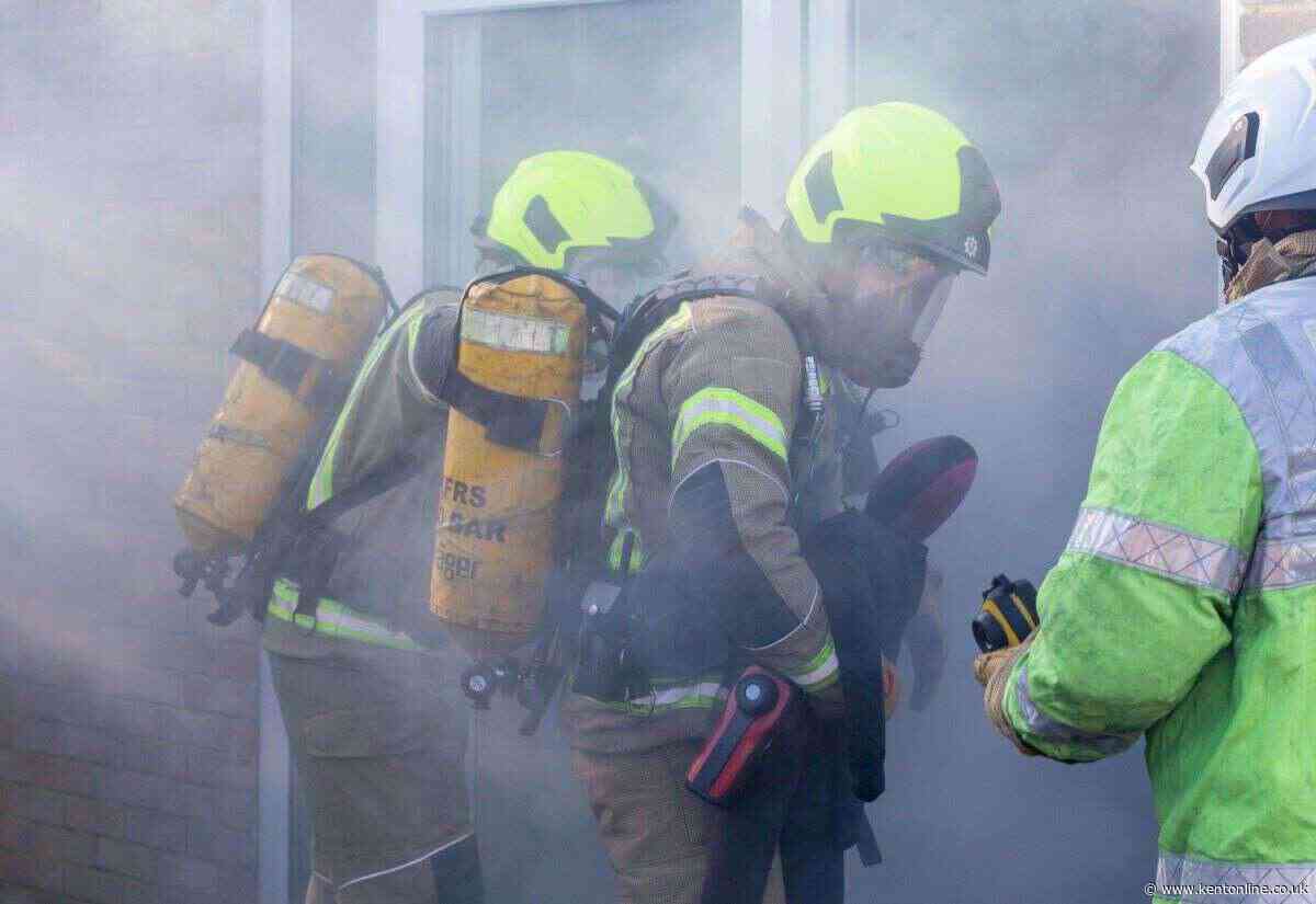 Two people treated by paramedics after garage fire