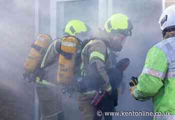 Two people treated by paramedics after garage fire