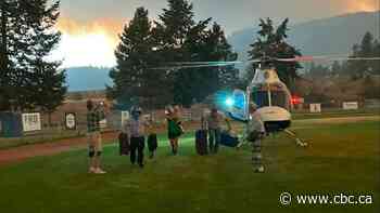 Temporary foreign workers experience harrowing helicopter evacuation from wildfire near Summerland