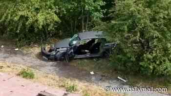 Two police officers are rushed to hospital after their unmarked car collided with an HGV