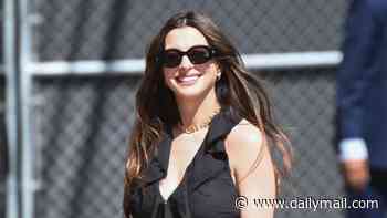 Pregnant Anne Hathaway flashes baby bump at Jimmy Kimmel after addressing speculation that she faked baby bump