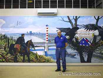 Mural commemorating armed forces lights up Lucas County Veterans Services Commission