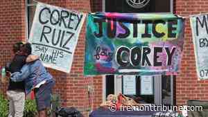 People gather at the site where Corey Ruiz was fatally shot by a police officer