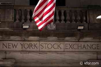Wall Street drifts below its all-time high as oil prices keep swinging