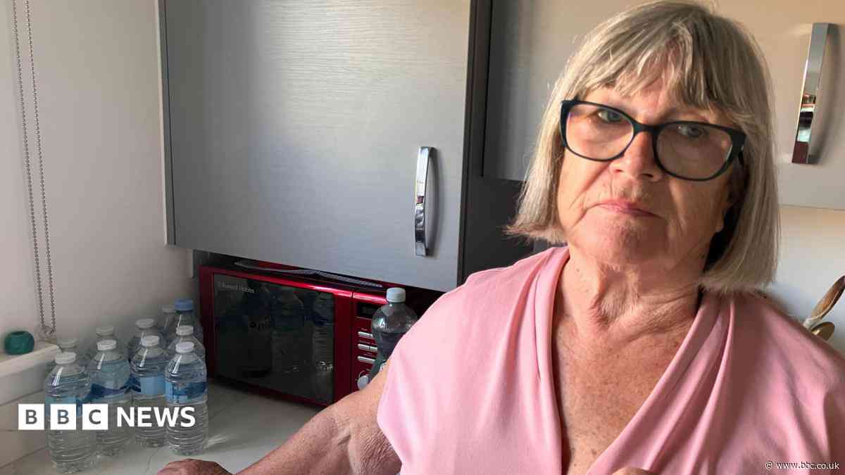 Woman buys back-up bottles due to water 'trickle'