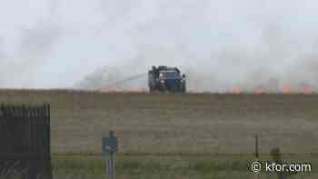 Fire crews battle grass fire near Will Rogers International Airport