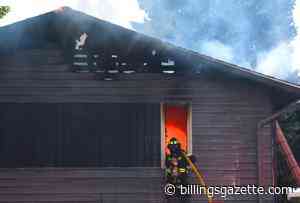 Photos: House that burned Friday rekindles Sunday morning