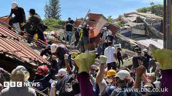 Anguish of Colombian brother at rubble of building being searched for earthquake survivors