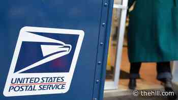 Federal judge reinforces block against Trump mail-in voting restrictions