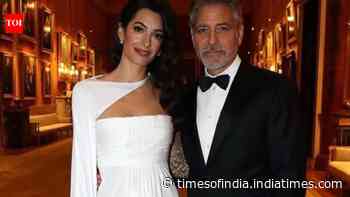 George and Amal Clooney attend fundraising event with twins