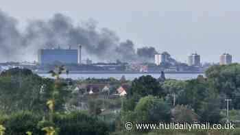 Firefighters 'continuing to tackle incident' as residents urged to 'avoid the area'