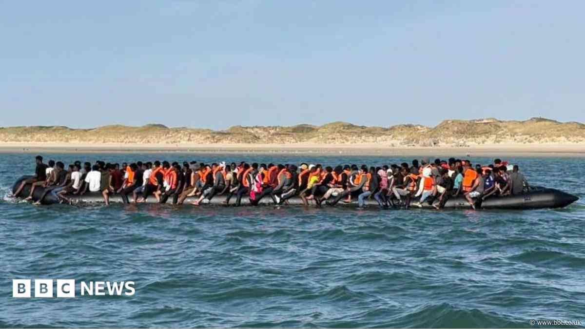 Record 230 people cross Channel in one small boat