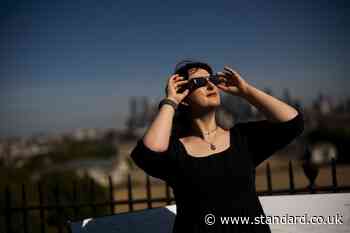 How can I watch the partial solar eclipse safely?