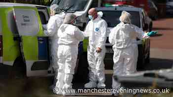 Cop in tears as forensics comb Salford flat where man was found dead