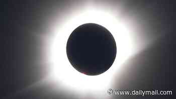 Solar eclipse in pictures: Stunning snaps show the moment the moon covered the face of the sun