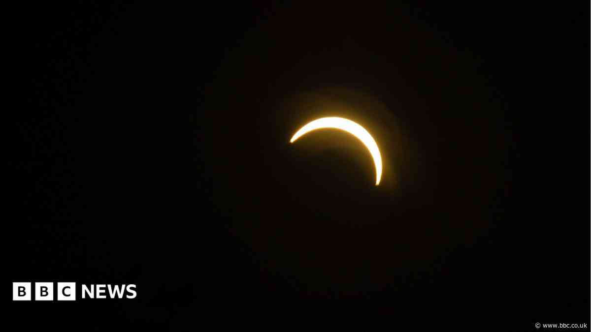 In pictures: Sky watchers gather for solar eclipse