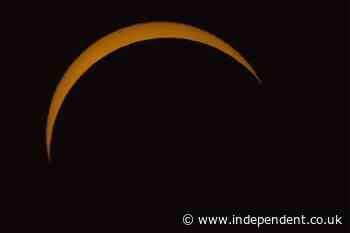 Skywatchers across UK wowed as rare solar eclipse blots out most of the sun