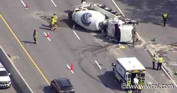 Two hurt after blown tire causes truck to overturn, spill concrete on I-40 in Garner