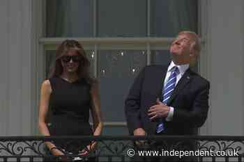 White House appears to troll Trump on eclipse day by sharing iconic picture of president staring at the sun