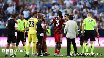 Fulham leave pitch as Malaga take penalty into empty net