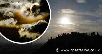 Atmospheric eclipse snaps as people pack Roseberry Topping to watch celestial event