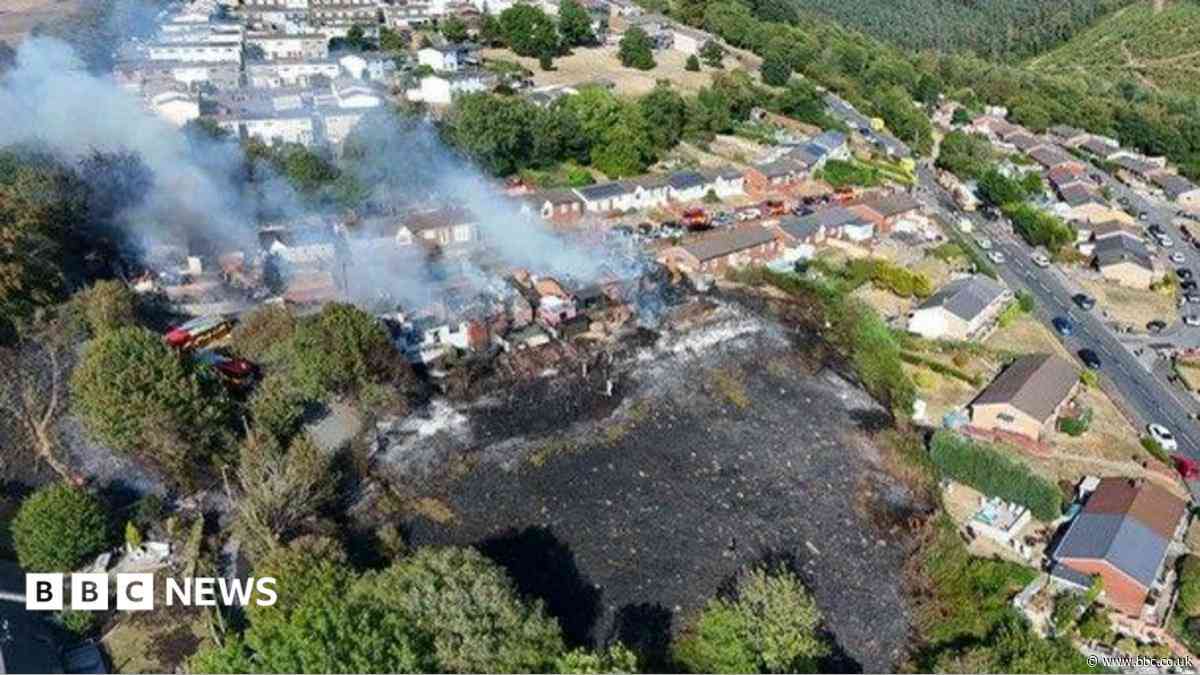Arson arrest after massive fire destroys homes