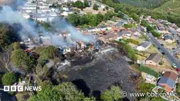 Arson arrest after massive fire destroys homes