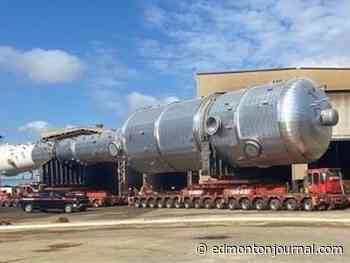 Wide load trailer with 448 wheels moving between Edmonton and Fort Saskatchewan