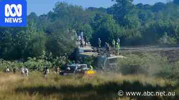 Passenger train derails and flips over in southern England