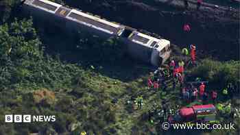 Aerial footage shows derailed train