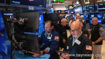 U.S. stocks rise to a record as oil prices drop and inflation gets less bad