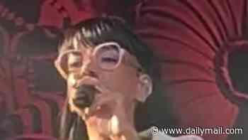 Lily Allen stuns in a sexy satin corset during her show in Sweden after swapping her stage lingerie for a cosy T-shirt and a Cornish pasty in backstage snaps