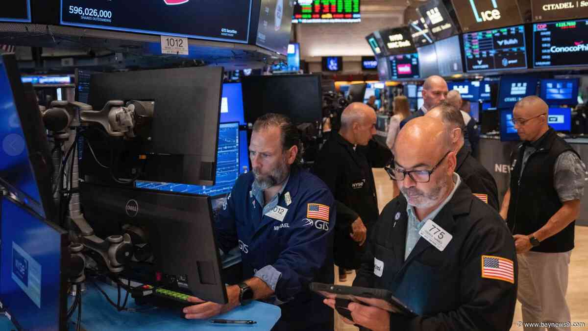 U.S. stocks rise to a record as oil prices drop and inflation gets less bad
