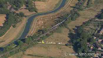 Passenger train derails and 11 people injured after carriages overturn in southern England